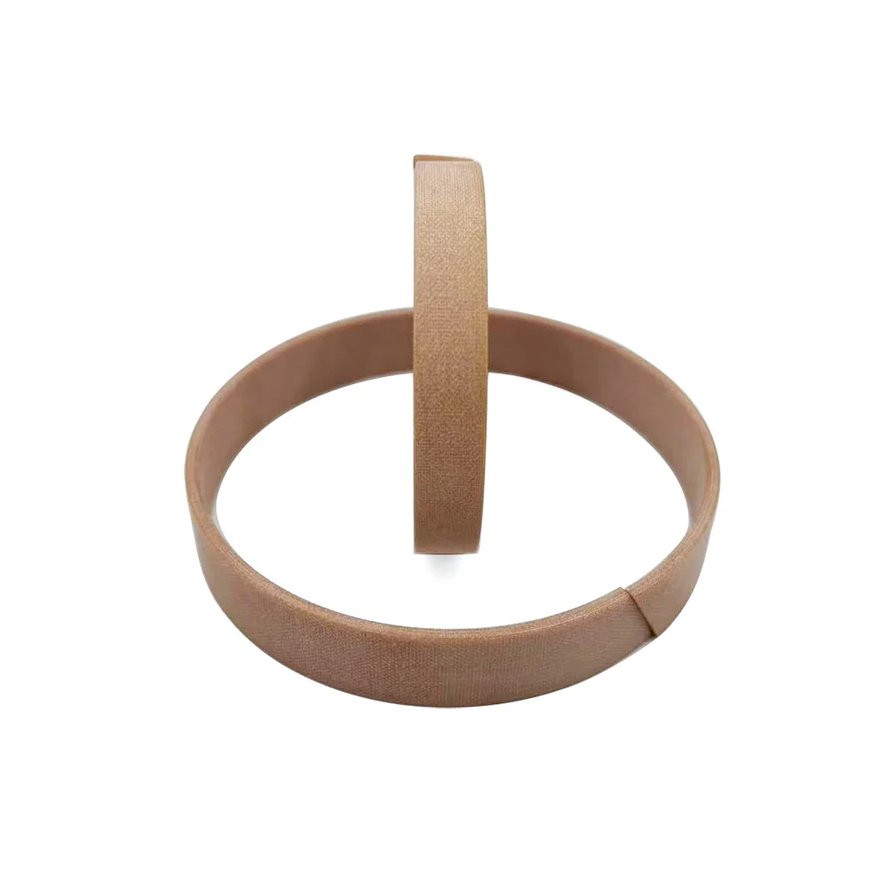 Phenolic resin with fabric wear rings for hydraulic cylinder guide support