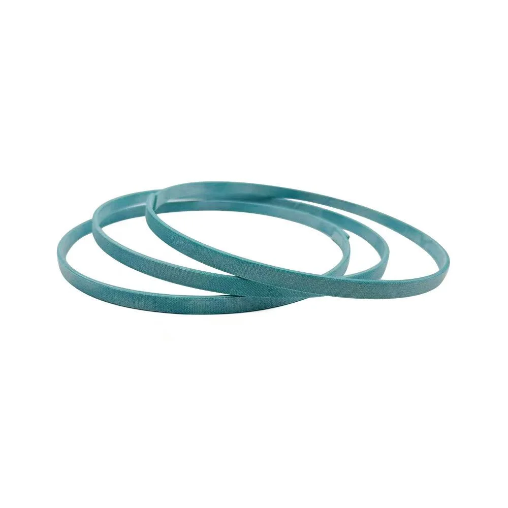Phenolic resin with fabric wear ring for hydraulic cylinder guide support