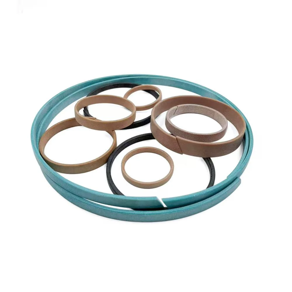 Phenolic resin with fabric wear ring for hydraulic cylinder guide support